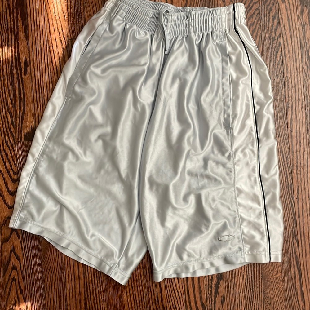 Mens size small silver Champion brand shorts with white strip and black piping.
